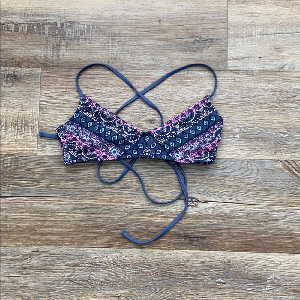 this is a pink blue peach and gray swim top (xs)